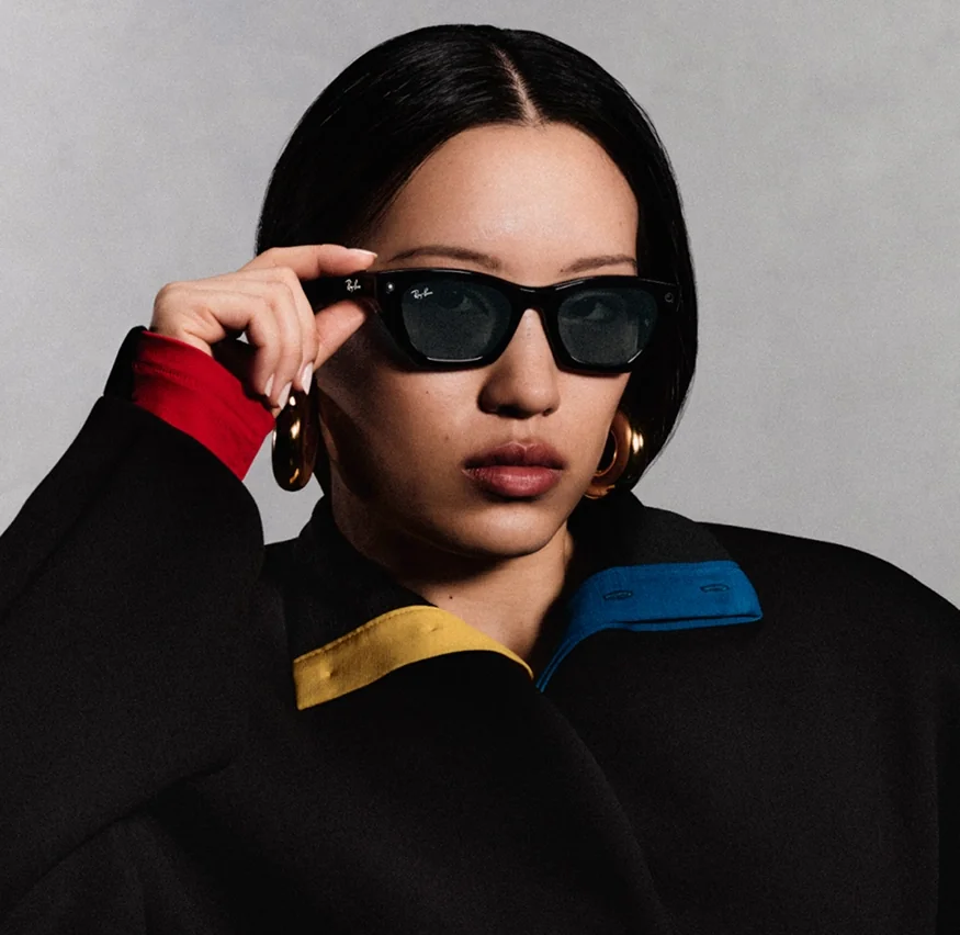 Person putting on Ray-Ban Meta glasses